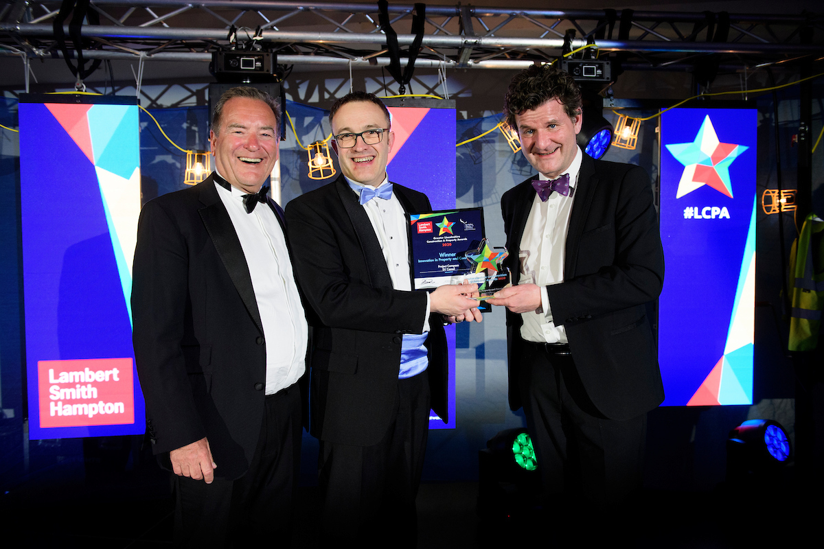 Three men in eveningwear smiling and posing with certificate and trophy at the Greater Lincolnshire Construction and Property Awards 2020