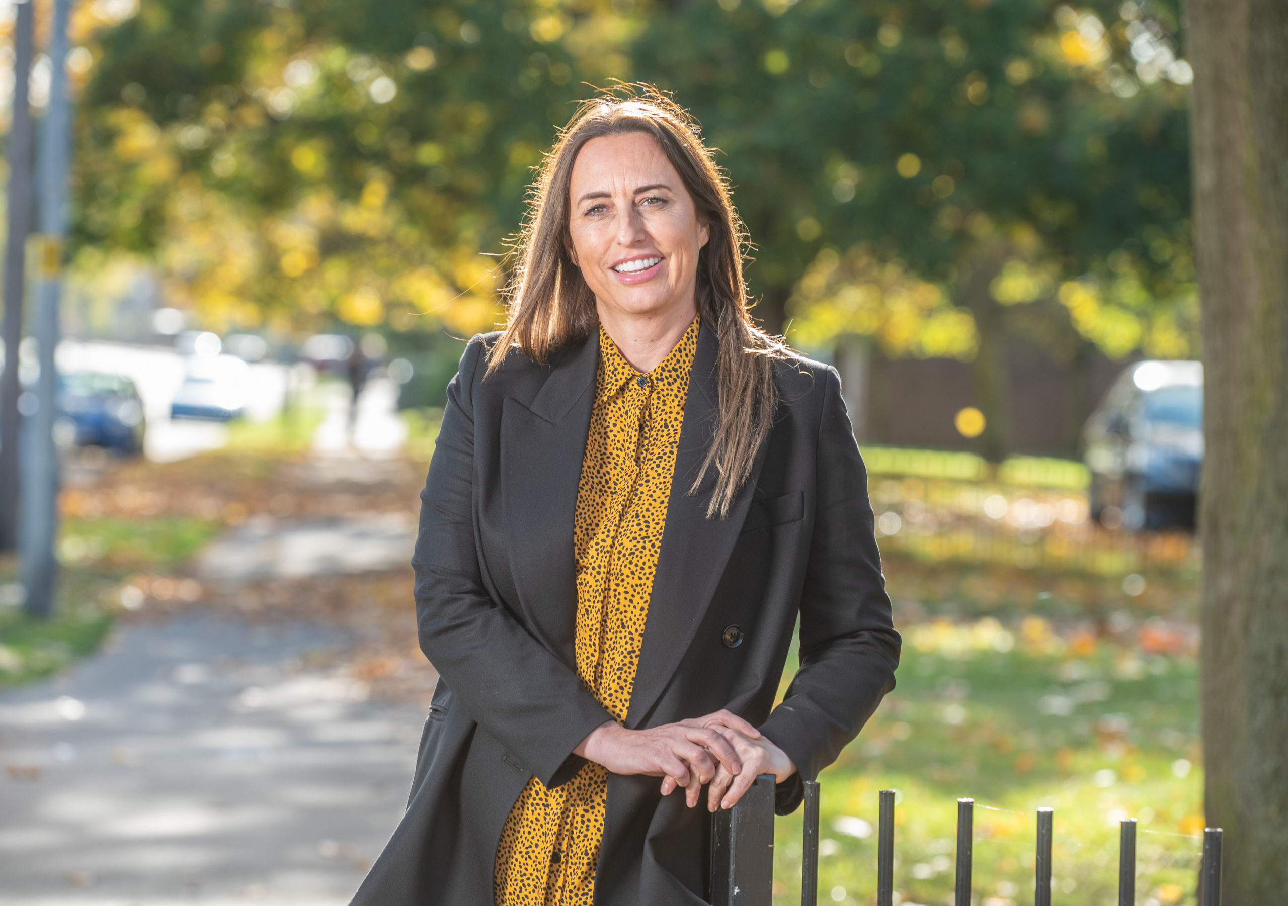 Dawn Hill of social housing developer Ongo. Brunette woman with dark coat in outdoor setting, smiling.