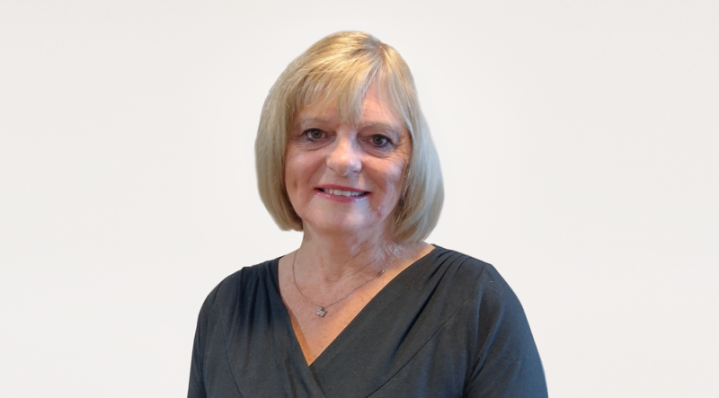 Eve Farley, a woman with short blonde hair, wearing dark top, smiling on white background. Eve is the International Trade Consultant for Lincolnshire Chamber of Commerce