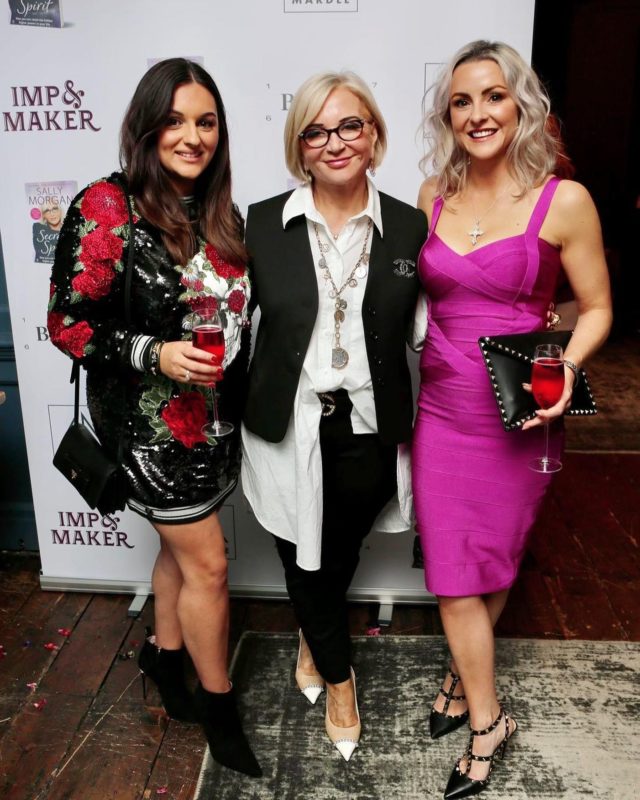Three woman in glamorous dresses at a book launch - Sarah Louise Fairburn and Sally Morgan