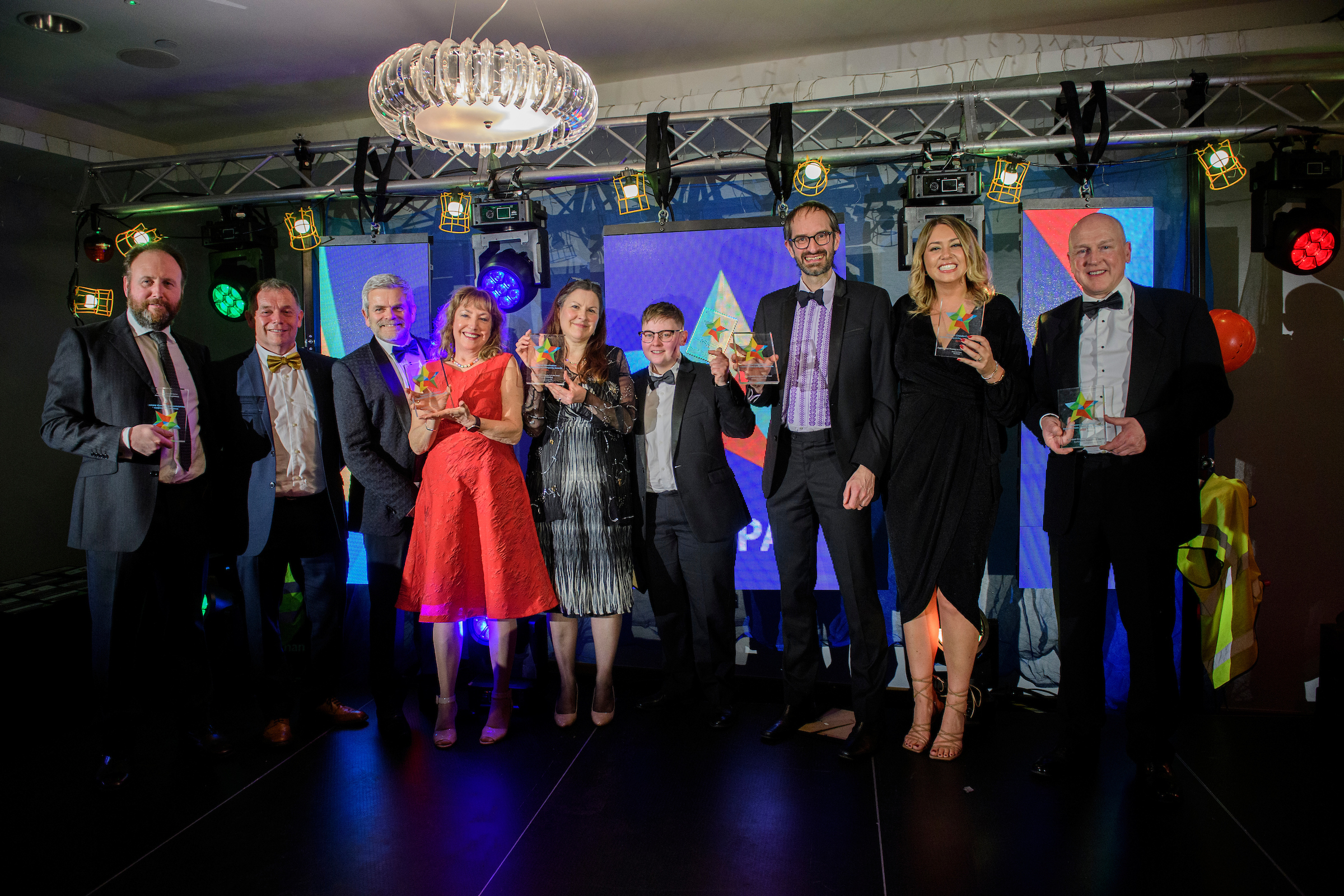 Group of people in eveningwear holding awards at the Greater Lincolnshire Construction and Property Awards 2022