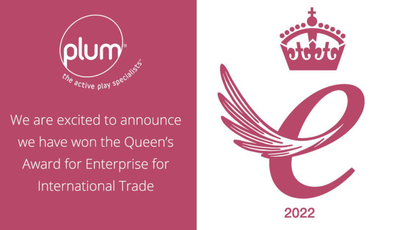 Pink and white background with Plum Play Products logo and Queen's Awards logo in pink on white, with white text about the business winning an award.