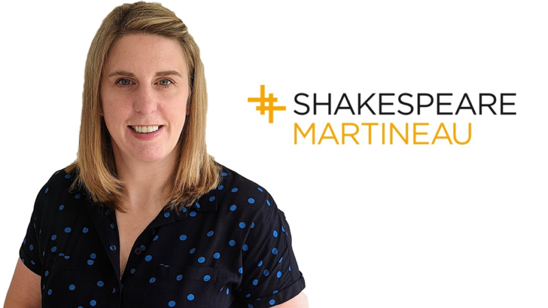 Nicola Holton, a blonde female wearing a black top, with Shakespeare Martineau logo in orange and black superimposed on the image, with white background