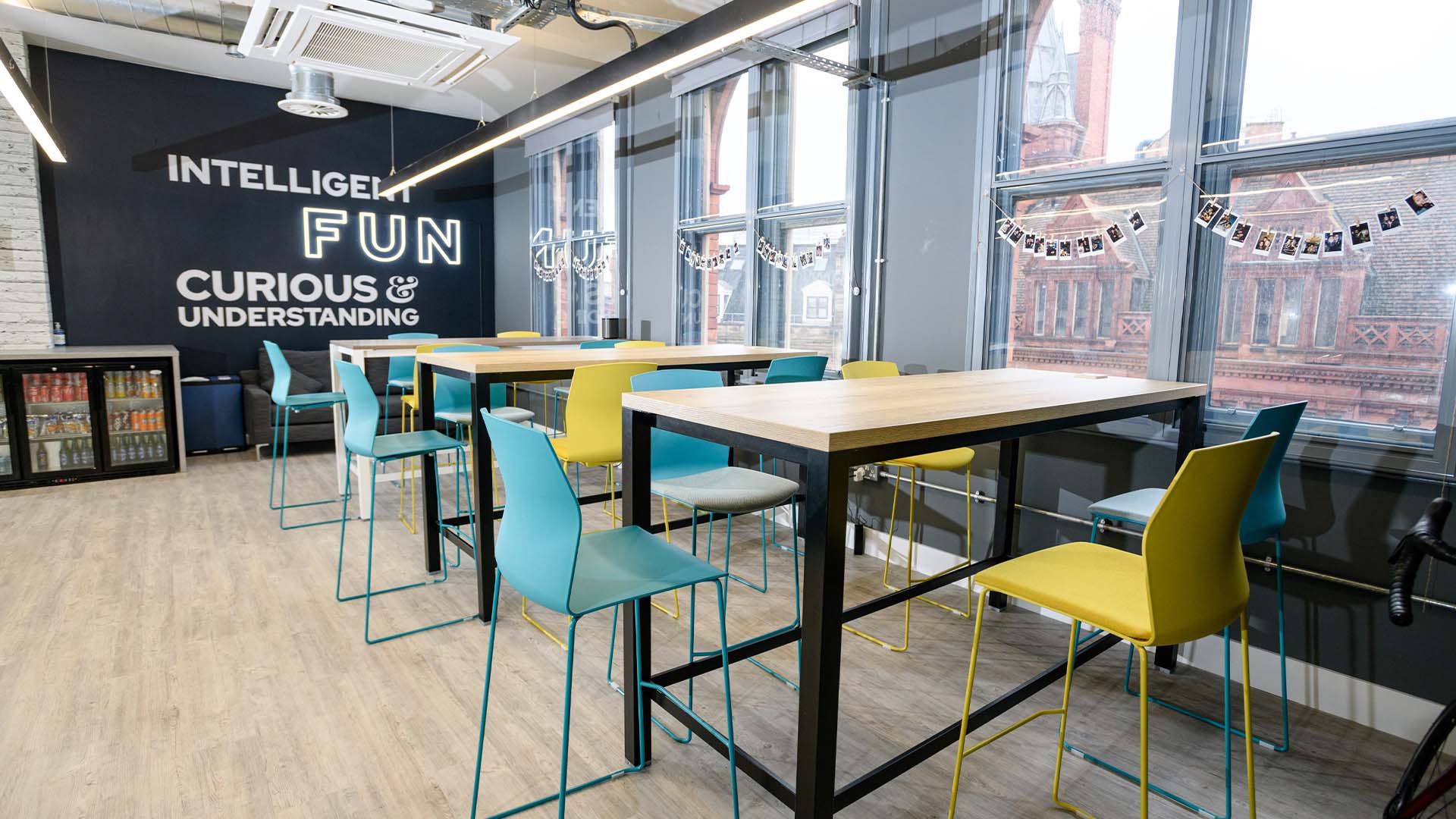 A modern office space with multiple chairs and tables.