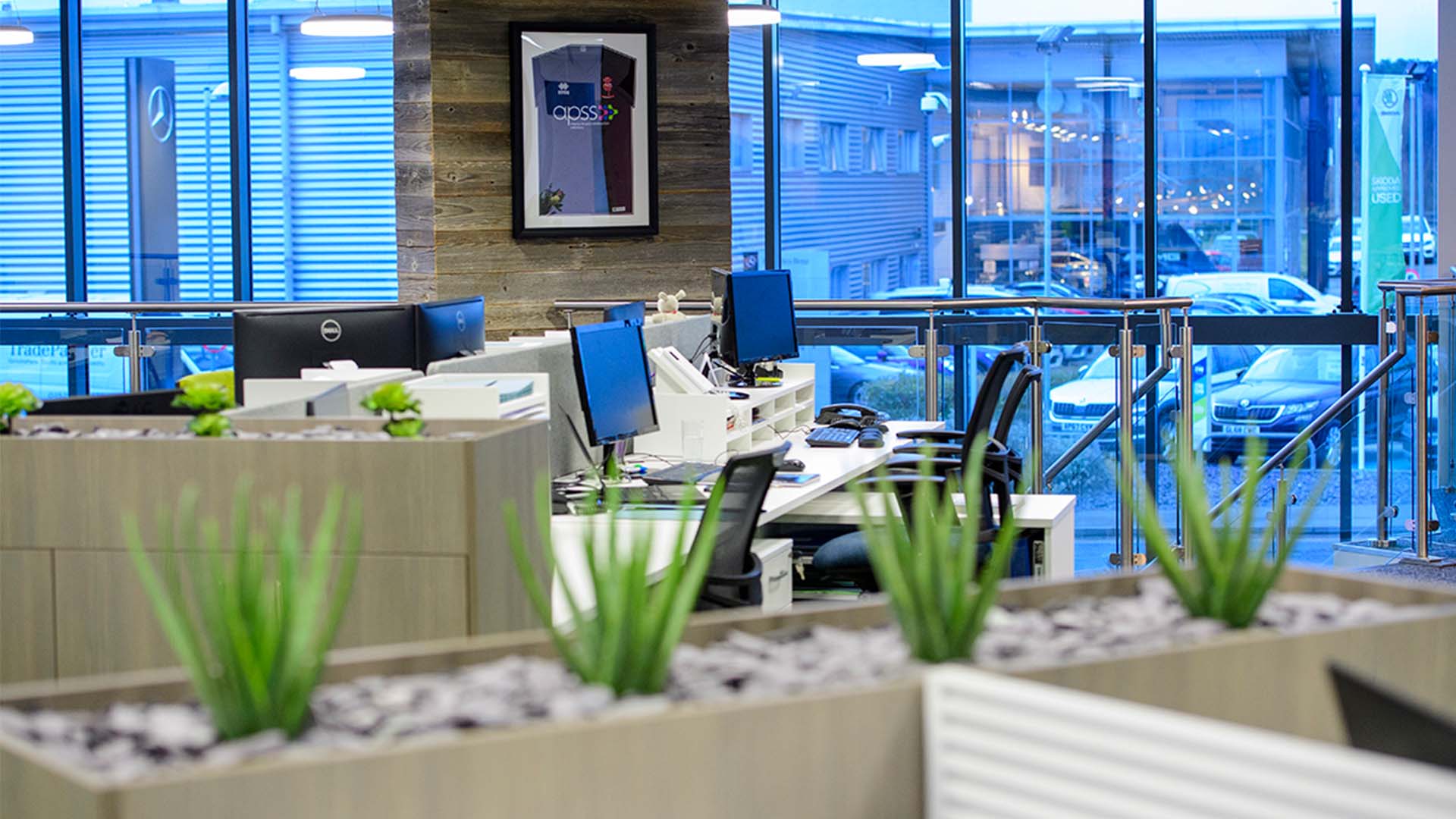 A modern office space with multiple chairs and tables.